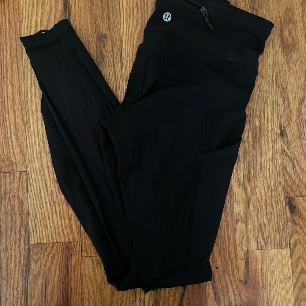 Black Lululemon Leggings with Pockets and Mesh Panels